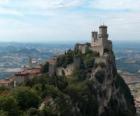 Towers with battlements or merlons of a castle that rests on the rocks