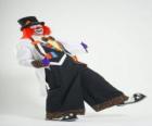 Clown with full clown costume, a hat, wig, gloves, tie, big pants and big shoes