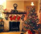 Fireplace in Christmas with the hung socks and with Christmas decorations