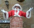 Santa Claus with problems to go through the chimney