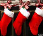 Christmas socks with decoration and hanging on the wall of the chimney