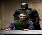 Batman interrogating his enemy the Joker