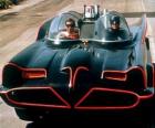 Batman and Robin in his Batmobile