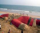 Santa Claus sculpture on the beach made