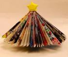 Christmas tree made from leaves of magazines and a yellow star at the tip