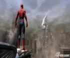 Spiderman, die Spinne, on top of a building by controlling the city
