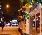 Street adorned with Christmas balls on the facades