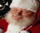 Happy with his Santa Claus hat and white beard