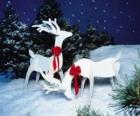 Two wooden reindeer with a red bow on a Christmas decoration