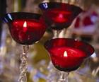 Three candles in crystal chandeliers