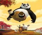 The Kung Fu master Shifu kicks on the backside of Po