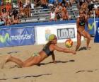 Beach Volleyball - Player of saving a ball in the eyes of his companion