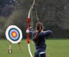 Archer pointing to the target in the open air