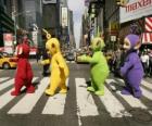 Po, Laa-Laa, Dipsy and Tinky-Winky crossing a street