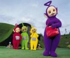 Po, Laa-Laa, Dipsy and Tinky-Winky with his red bag in front of your house