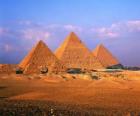 The Great Pyramid of Giza in the center along with two other important pyramids of the Giza Necropolis complex on the outskirts of Cairo, Egypt