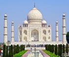 The Taj Mahal, the famous view of the mausoleum covered with white marble dome, in Agra, India