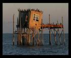 Stilt house with hut for fishermen, construction supported on piles in the lake