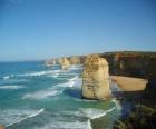 The Twelve Apostles, is a cluster of limestone needles protruding from the sea off the coast of Port Campbell National Park in Victoria, Australia.