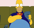 Homer Simpson on the couch at home eating potato chips