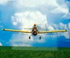 Aircraft spraying a field