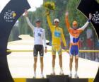 The podium of the 97th Tour de France: Alberto Contador, Andy Schleck and Denis Menchov, in Arc de Triomphe and the Champs Elysees background