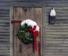 Wreath of Christmas hung in the doorway of a house