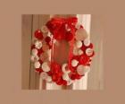 Christmas wreath made with buttons and a red bow