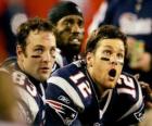 American football players sitting on the bench