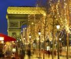 The Champs Élysées decorated for Christmas with the Arc de Triomphe in the background. Paris, France