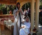 Mary, Joseph and baby Jesus in the manger living