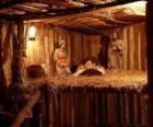 The Nativity scene figurines in a small wooden building