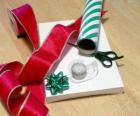Christmas gifts with decorative ribbon and scissors