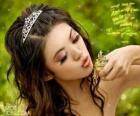 Princess giving a kiss to a frog