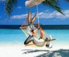 Bugs Bunny, the rabbit hero of the adventures of Looney Tunes, resting in the hammock