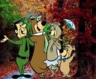 The protagonists of the adventures: Yogi Bear, Boo-Boo, Cindy and the park ranger Smith