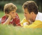 Dad talking to his son in the park