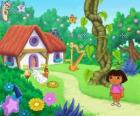 Dora, next to a house in the woods