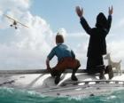 Tintin, Captain Haddock and Snowy on a boat after being shipwrecked