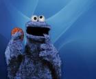 The Cookie Monster is eating a cookie