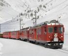 Train in a fully snow-covered landscape