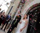 The bride and groom leaving the wedding ceremony