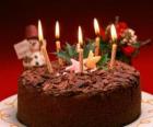 Cake with five candles for the celebration of the birthday