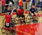 Wheelchair basketball player throwing the ball to the basket