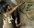 A prehistoric artist realising a cave painting representing a buffalo in the wall of a cave while is observed by a dinosaur from outside