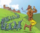 The Pied Piper of Hamelin playing the flute followed by rats