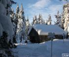 Cabin of wood a heavy snowfall