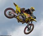 Motocross driver, making a spectacular jump