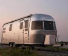 Travel trailer or caravan. Mobile home, closed trailer that is pulled down by another vehicle