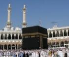 Muslim pilgrims walking around the Kaaba, a cube-shaped building in Makkah, Saudi Arabia